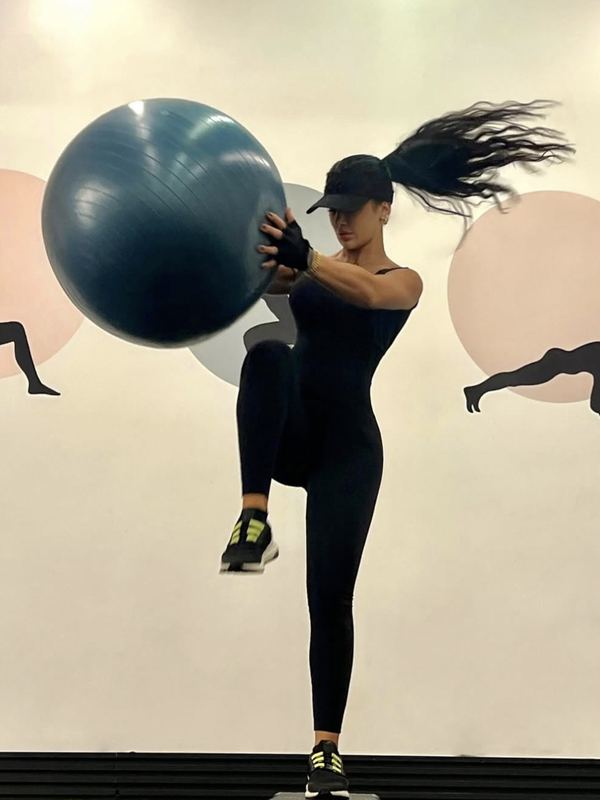 Coach Nadine working out with a stability ball
